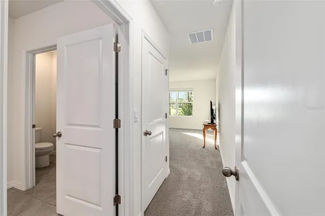 a bathroom with a bathtub shower sink vanity and a mirror