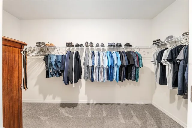 an aerial view of a house with garden space and ocean view