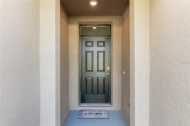 a living room with furniture a window and a table