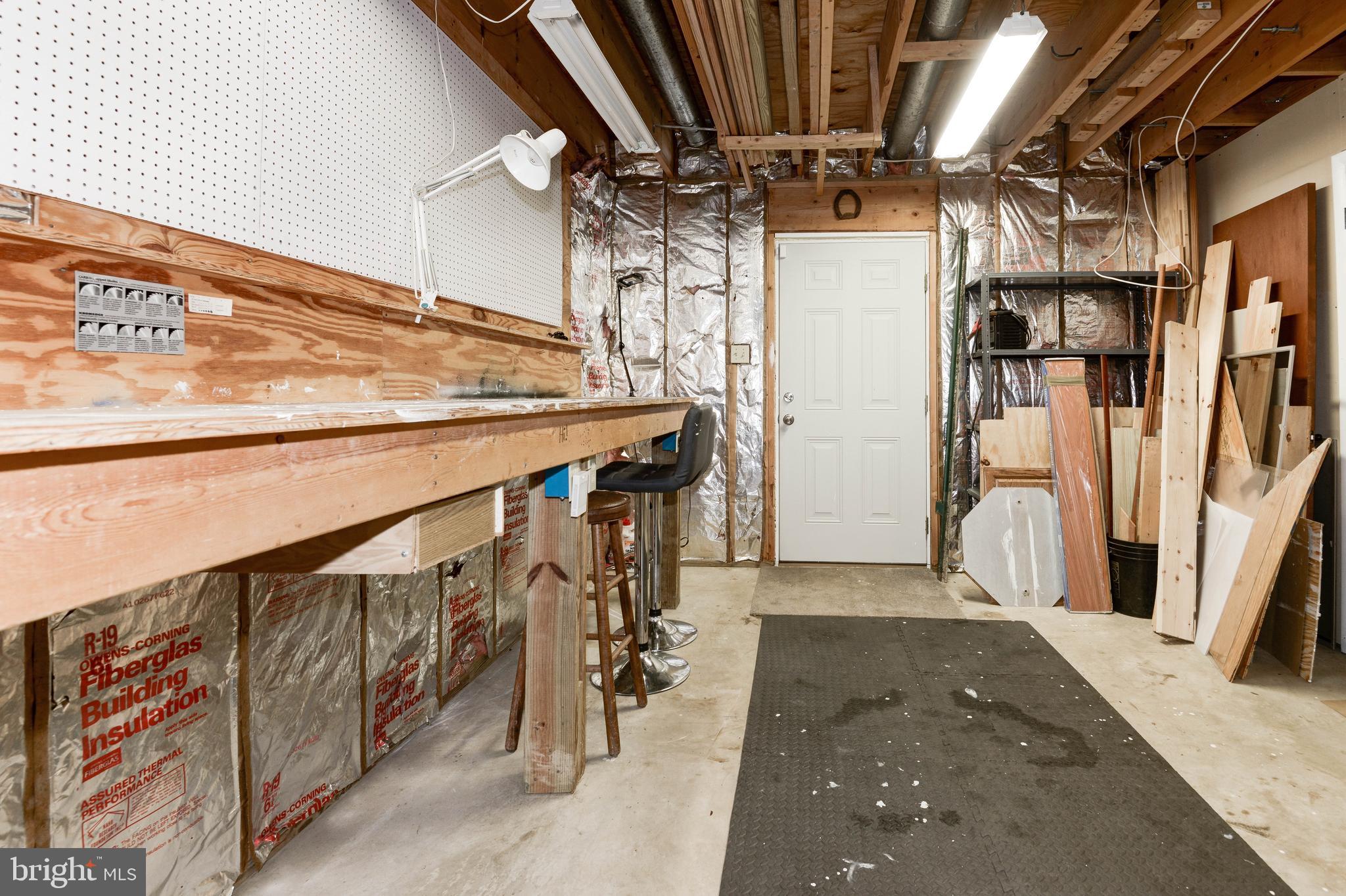 1619 Summit Drive Haymarket, VA 20169 - Photo 38 of 62 a view of water heater room with stairs