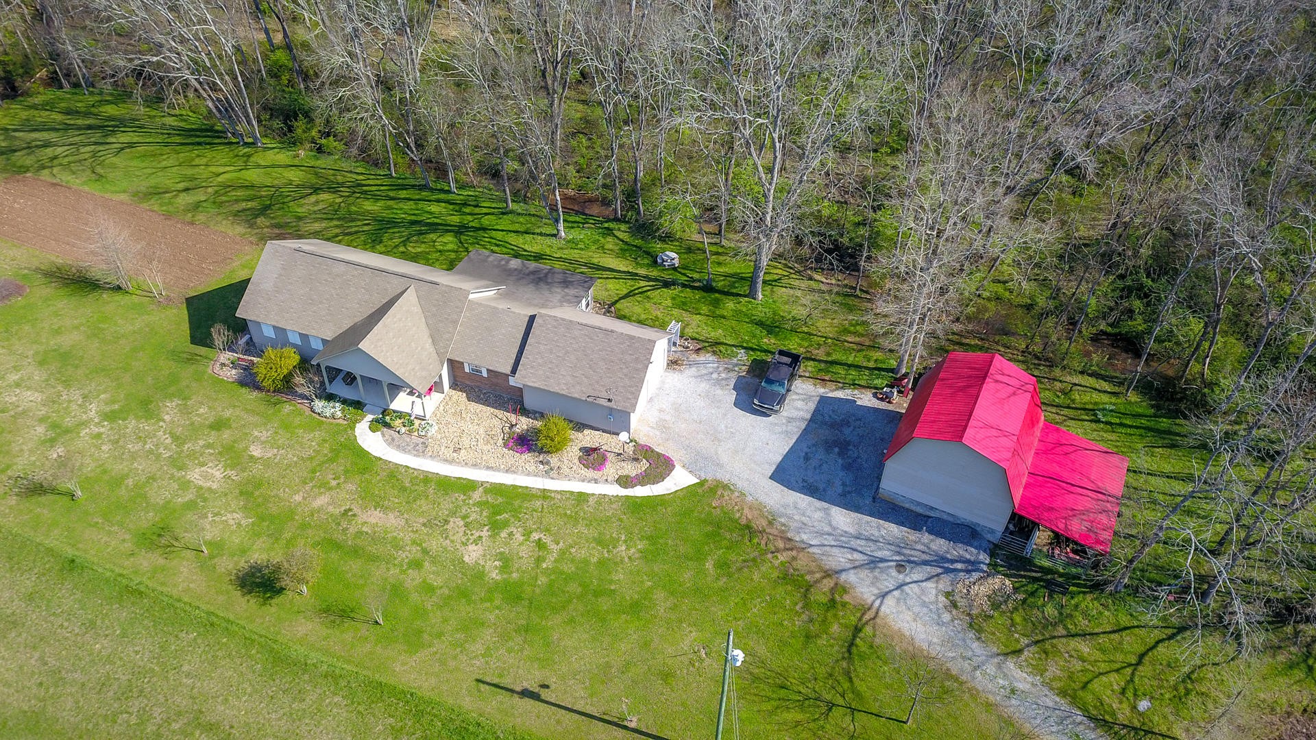 4575 Sunnyside Road Philadelphia, TN 37846 - Photo 31 of 33 an aerial view of a house with backyard and pool