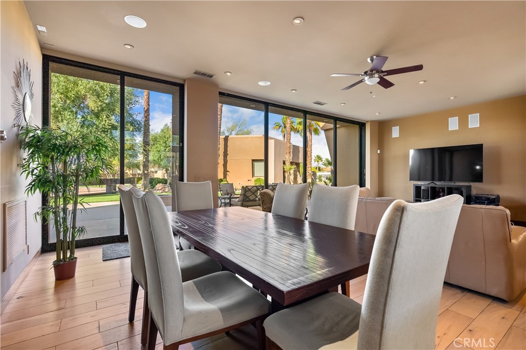68 Royal St Georges Way Rancho Mirage, CA 92270 - Photo 36 of 75 a view of a dining room with furniture window and wooden floor