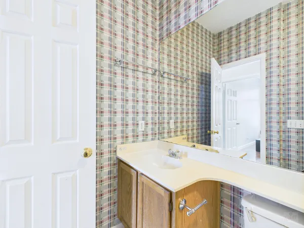 a bathroom with a sink and a mirror