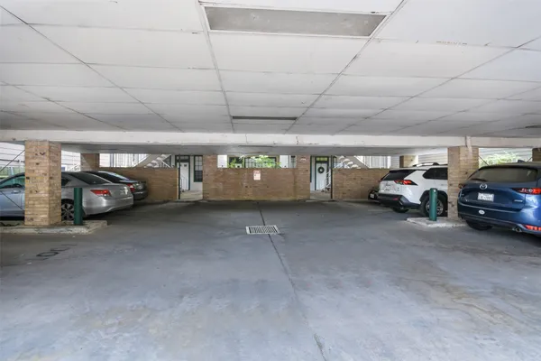 a view of parking space with parked cars