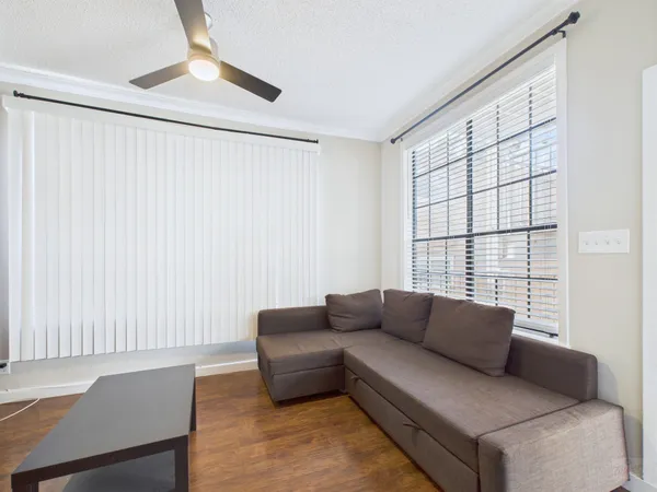 a living room with furniture and a window