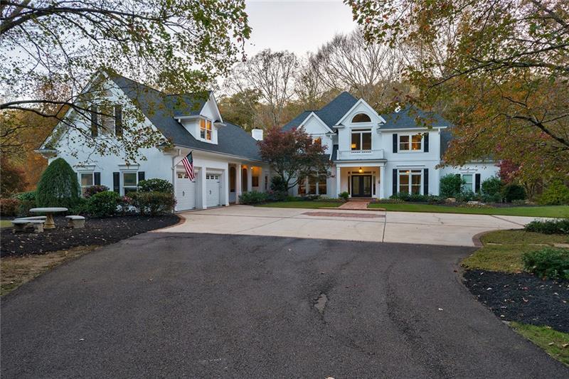 1801 Birmingham Road Milton, GA 30004 - Photo 2 of 102 a front view of a house with a yard and garage