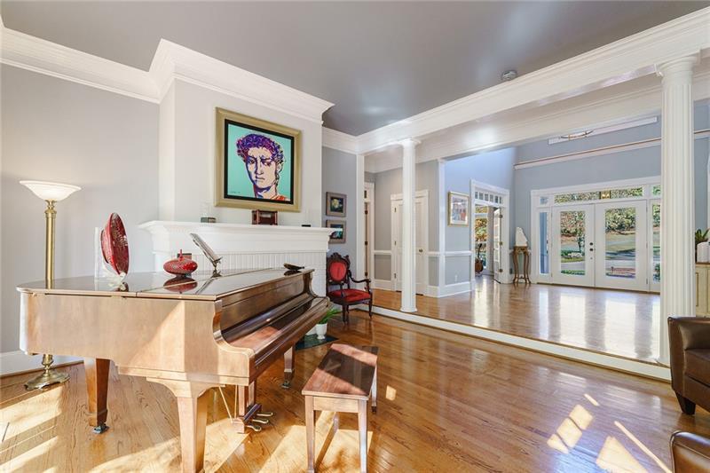1801 Birmingham Road Milton, GA 30004 - Photo 26 of 102 a living room with furniture and a floor to ceiling window
