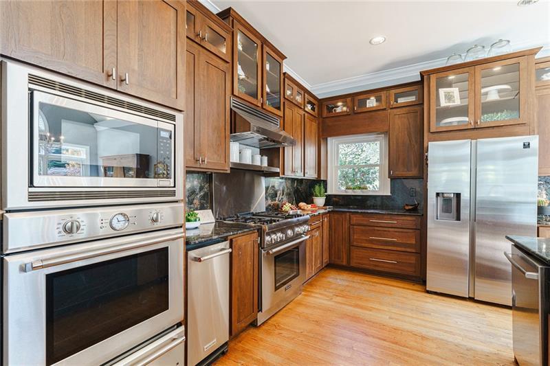 1801 Birmingham Road Milton, GA 30004 - Photo 31 of 102 a kitchen with stainless steel appliances granite countertop a stove and a refrigerator