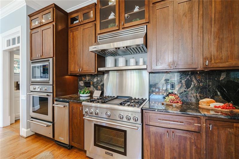 1801 Birmingham Road Milton, GA 30004 - Photo 32 of 102 a kitchen with stainless steel appliances granite countertop a stove and a refrigerator