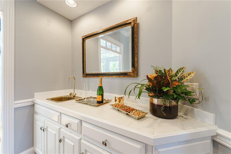 1801 Birmingham Road Milton, GA 30004 - Photo 43 of 102 a bathroom with a sink a vanity and a mirror