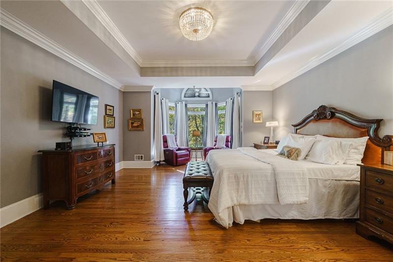 1801 Birmingham Road Milton, GA 30004 - Photo 46 of 102 a bedroom with a bed and wooden floor