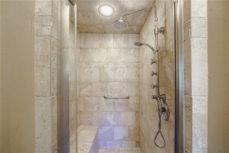 1801 Birmingham Road Milton, GA 30004 - Photo 50 of 102 a bathroom with a glass shower door