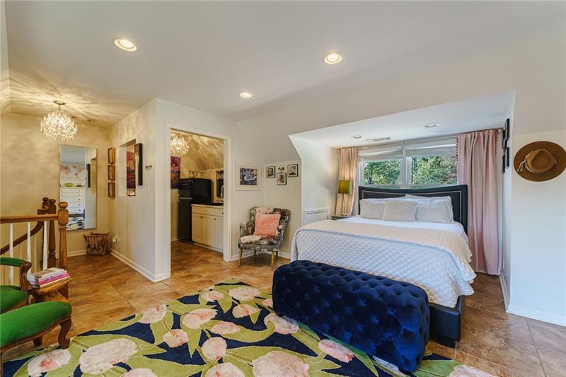 1801 Birmingham Road Milton, GA 30004 - Photo 60 of 102 a spacious bedroom with a large bed a rug and windows