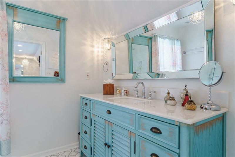 1801 Birmingham Road Milton, GA 30004 - Photo 63 of 102 a bathroom with a sink vanity and mirror