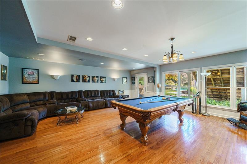 1801 Birmingham Road Milton, GA 30004 - Photo 68 of 102 a living room with furniture a table and large windows