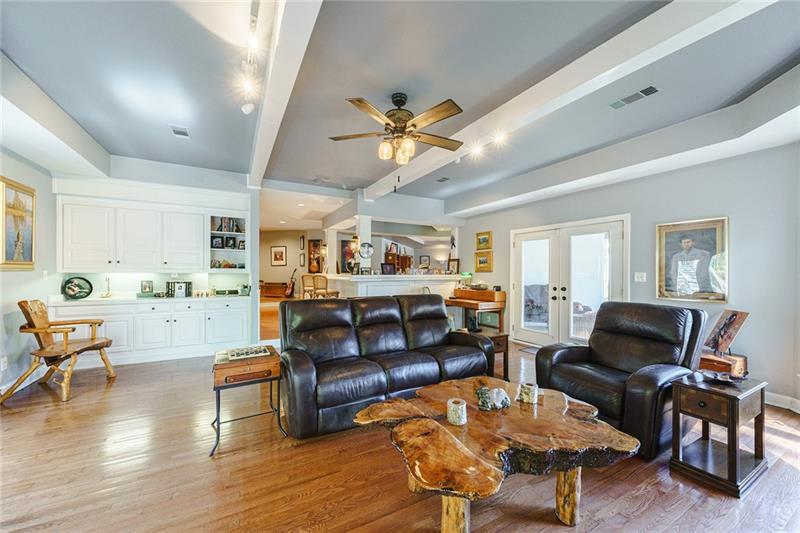 1801 Birmingham Road Milton, GA 30004 - Photo 71 of 102 a living room with furniture kitchen view and a wooden floor