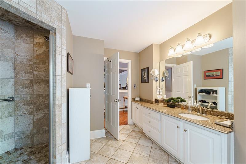 1801 Birmingham Road Milton, GA 30004 - Photo 73 of 102 a spacious bathroom with a double vanity sink a mirror and a shower