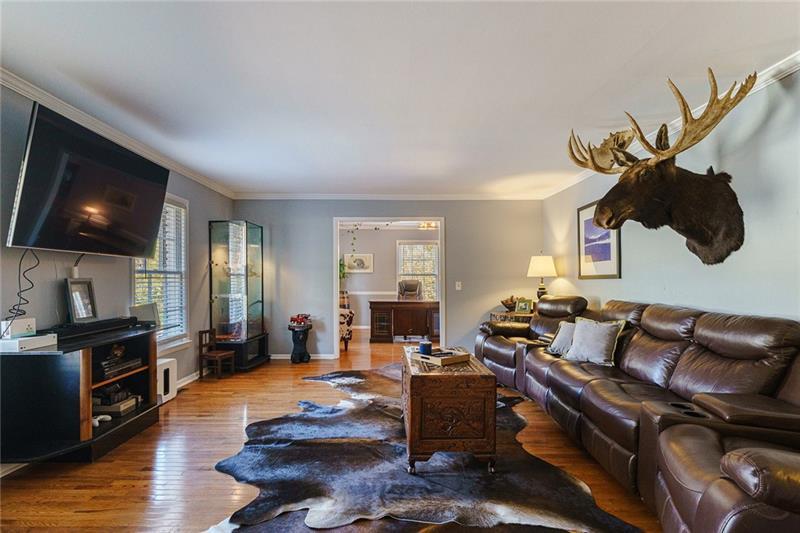 1801 Birmingham Road Milton, GA 30004 - Photo 92 of 102 a living room with furniture and a flat screen tv