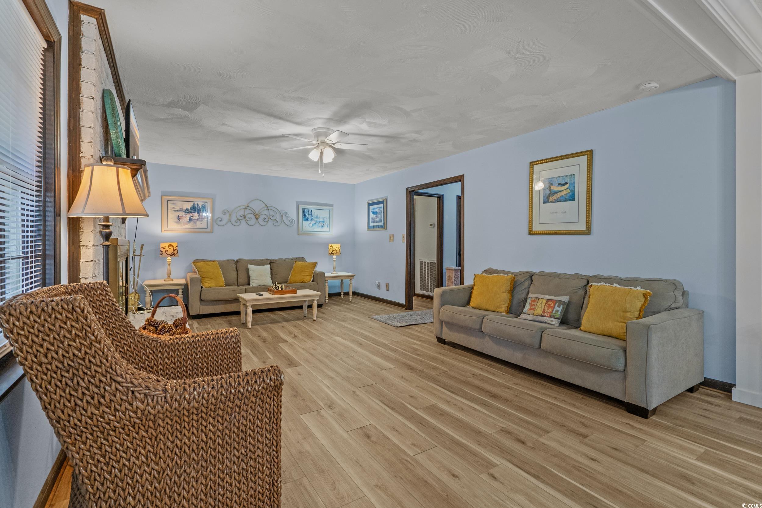 1063 Burcale Road Myrtle Beach, SC 29579 - Photo 12 of 36 Living room with light wood-style flooring and ceiling fan