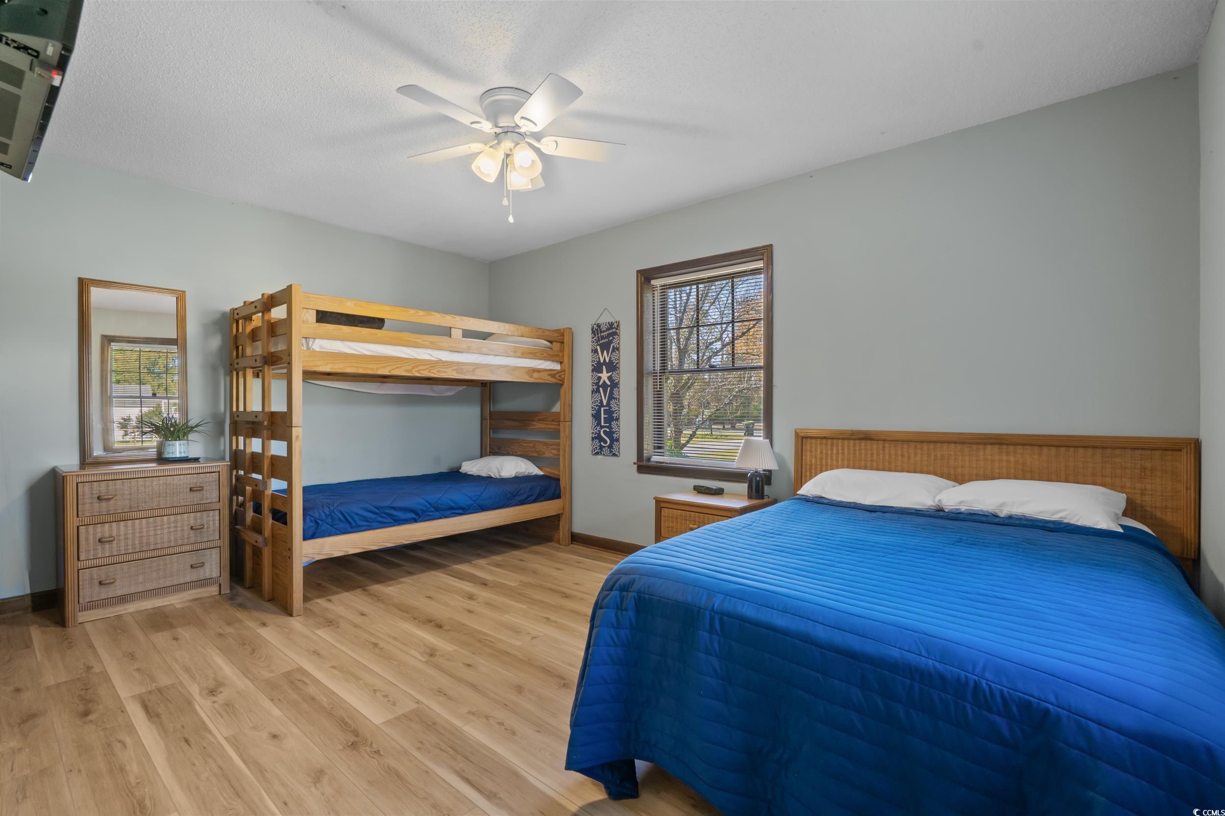 1063 Burcale Road Myrtle Beach, SC 29579 - Photo 29 of 36 Bedroom with light wood-style flooring and ceiling fan