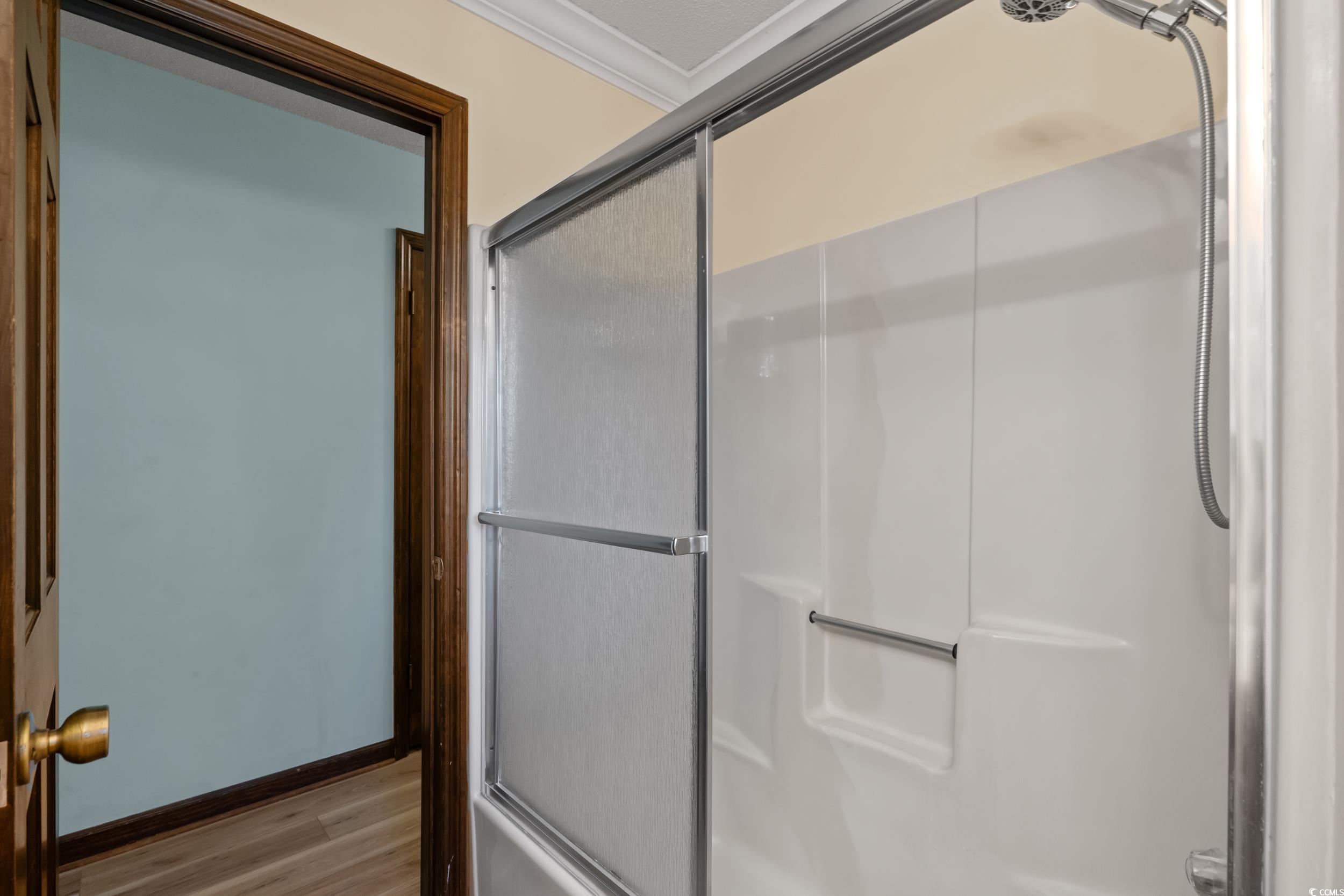 1063 Burcale Road Myrtle Beach, SC 29579 - Photo 33 of 36 Full bathroom with a shower with door, crown molding, and wood finished floors