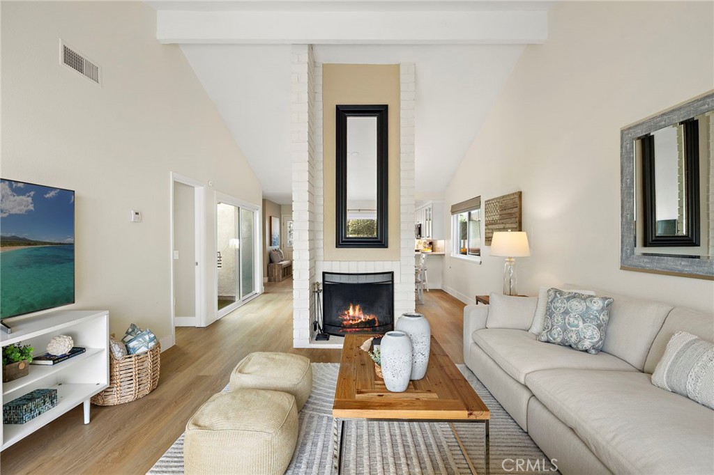 3326 Paseo Halcon San Clemente, CA 92672 - Photo 12 of 28 a living room with furniture and a fireplace