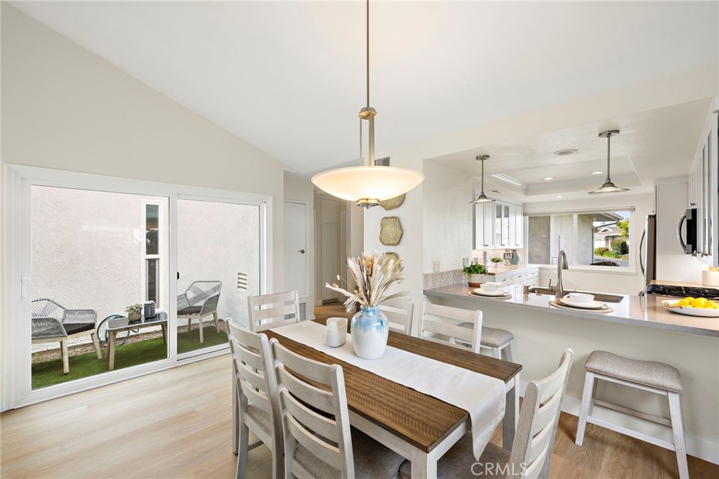 3326 Paseo Halcon San Clemente, CA 92672 - Photo 13 of 28 a dining room with furniture and a wooden floor