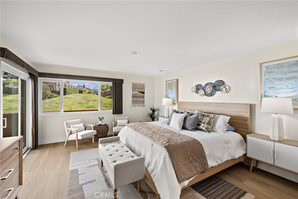 3326 Paseo Halcon San Clemente, CA 92672 - Photo 14 of 28 a bedroom with a bed and a large window