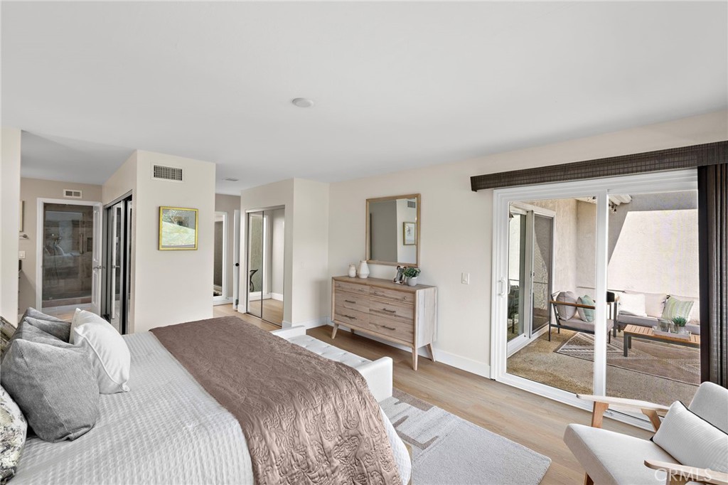 3326 Paseo Halcon San Clemente, CA 92672 - Photo 15 of 28 a bedroom with a bed and large mirror with furniture