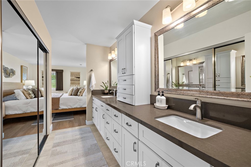 3326 Paseo Halcon San Clemente, CA 92672 - Photo 18 of 28 a en suite bathroom with double vanity and a large mirror