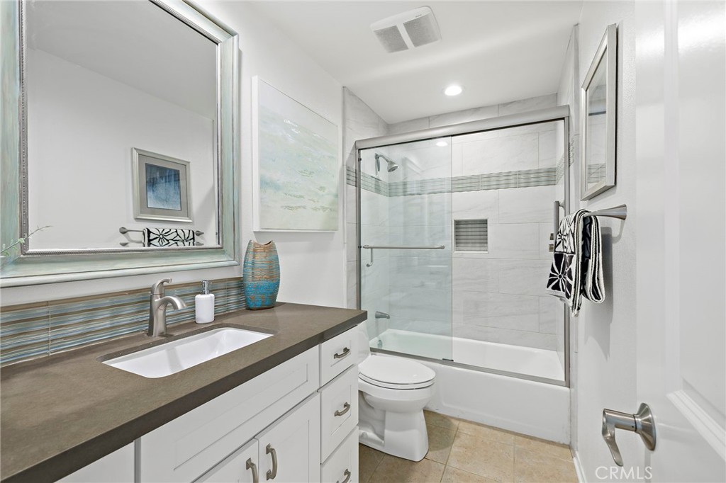 3326 Paseo Halcon San Clemente, CA 92672 - Photo 22 of 28 a bathroom with a sink double vanity granite toilet and shower