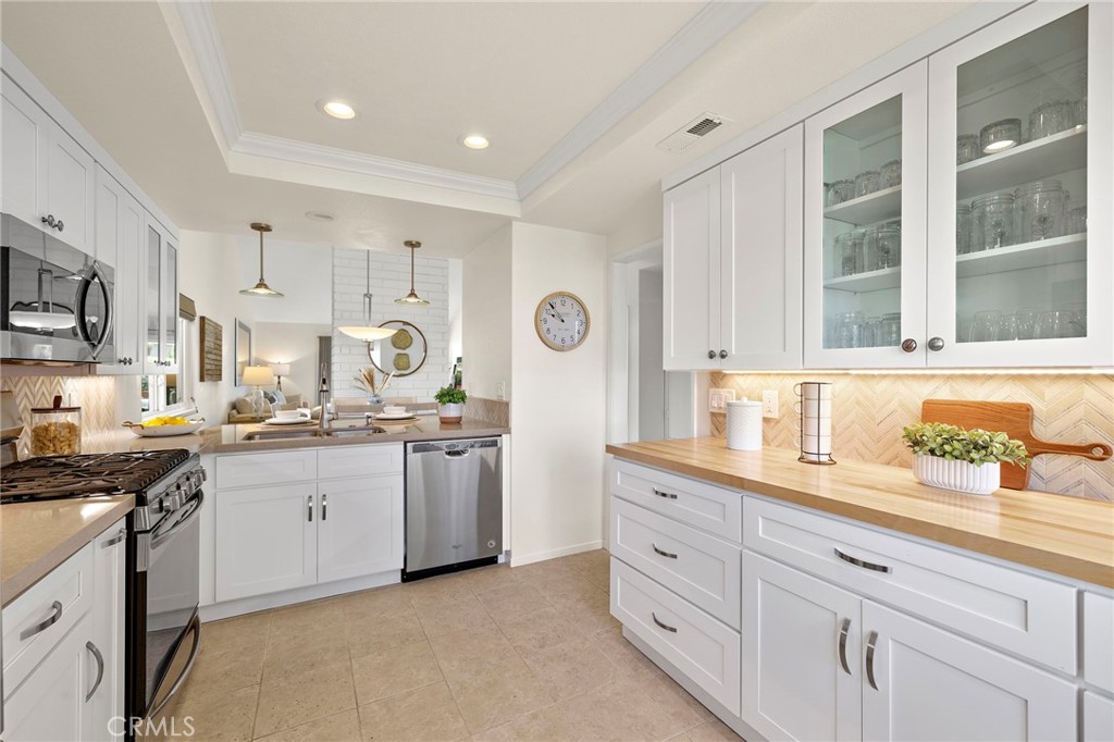 3326 Paseo Halcon San Clemente, CA 92672 - Photo 8 of 28 a kitchen with granite countertop a sink and cabinets