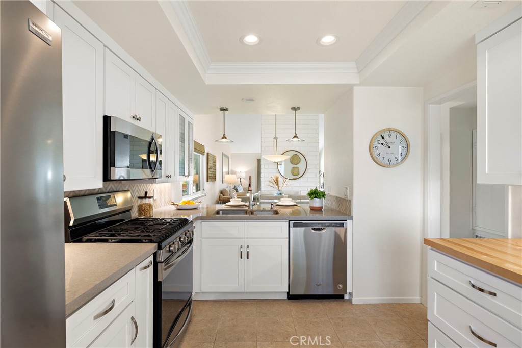 3326 Paseo Halcon San Clemente, CA 92672 - Photo 10 of 28 a kitchen with a sink cabinets and stainless steel appliances