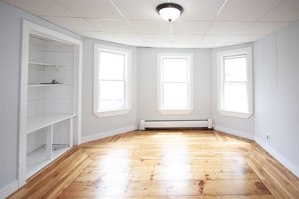 66 Cutler Street Worcester, MA 01604 - Photo 8 of 27 a view of an empty room with a window