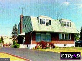 1572 Blackrock Road Swarthmore, PA 19081 - Photo 1 of 1 a front view of a house with a garden