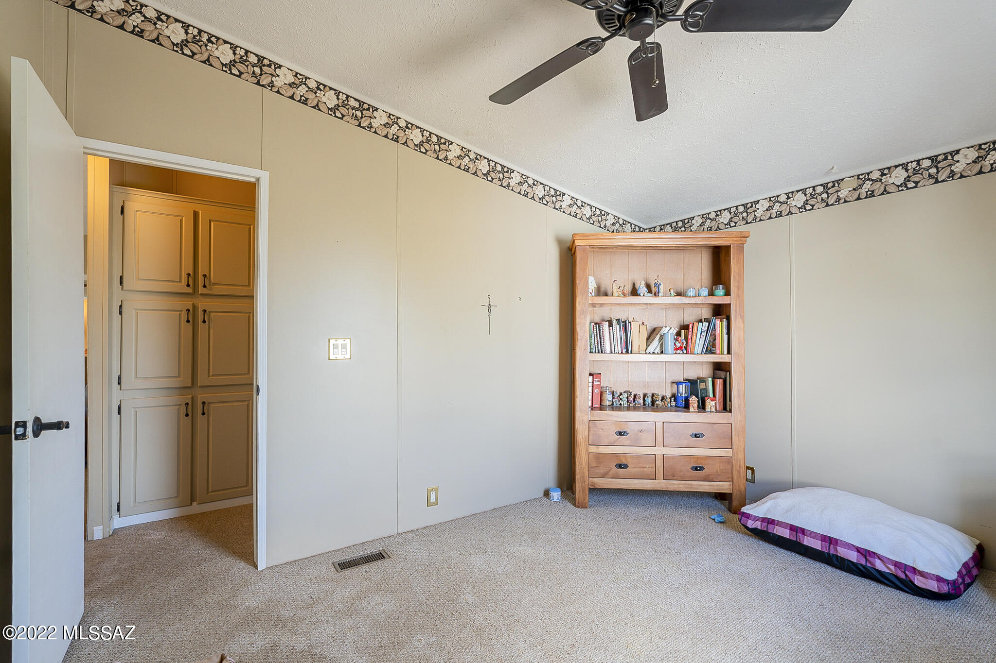 5285 North Puma Road Marana, AZ 85653 - Photo 25 of 46 a view of room with cabinet and ceiling fan