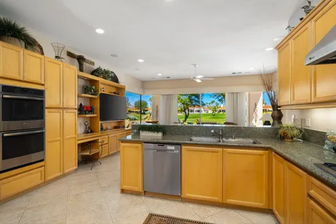 a kitchen with lots of counter top space and appliances