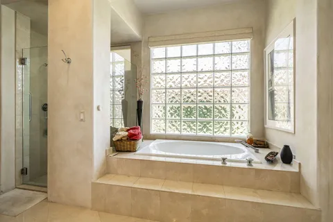 a bath tub sitting next to a window