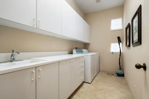 a utility room with cabinets