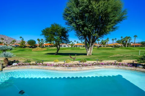 a view of a lake with a yard and green space