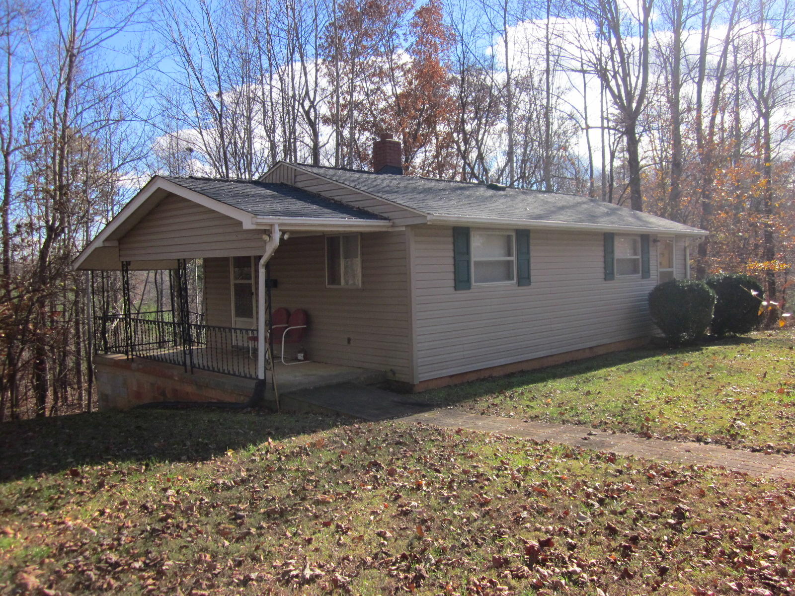 1928 Swelling Road Ferrum, VA 24088 - Photo 2 of 18 a front view of a house with garden