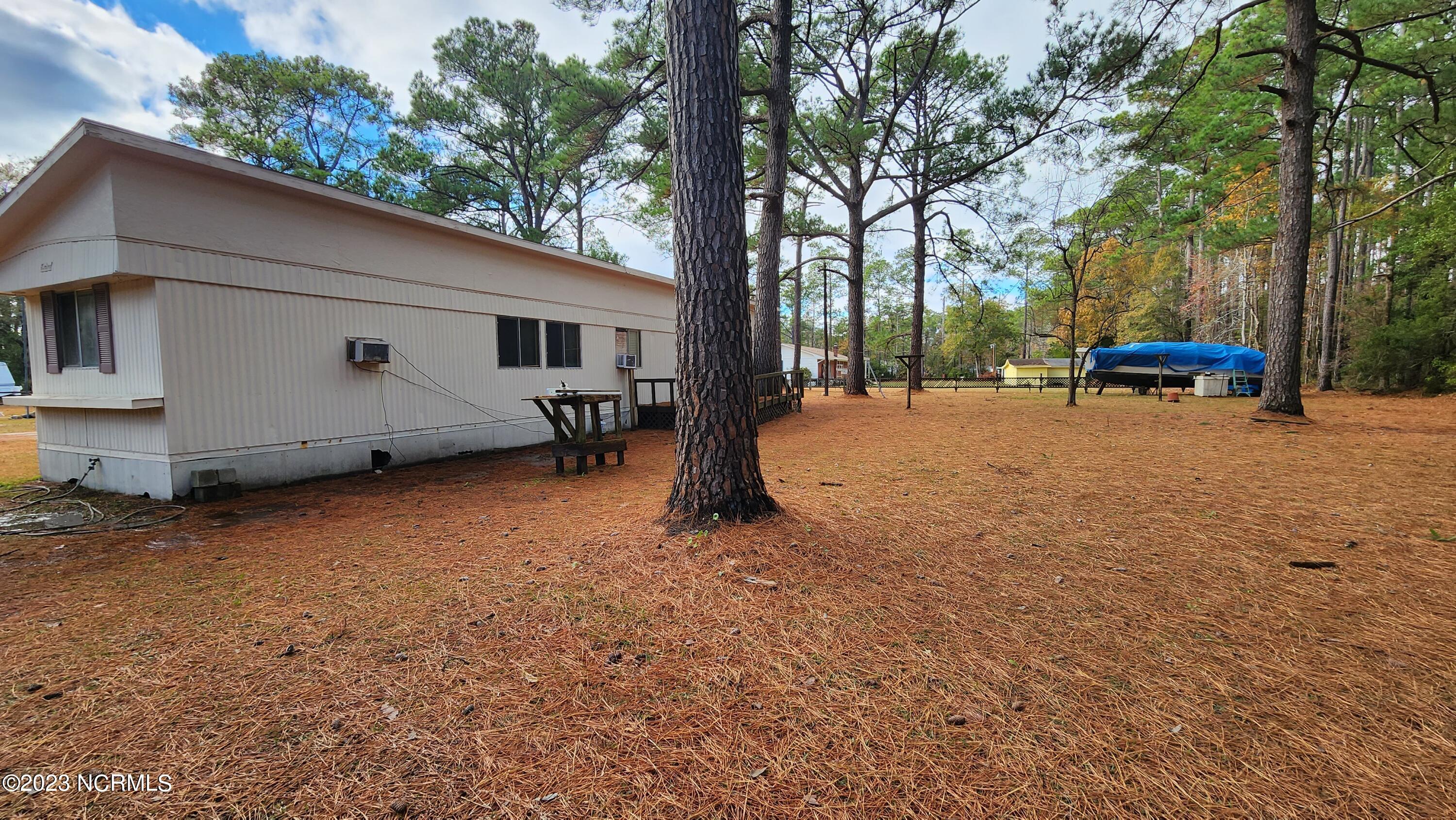 184 North Pigott Road Gloucester, NC 28528 - Photo 6 of 8 So many options to make this expansive back yard everything you want it to be.