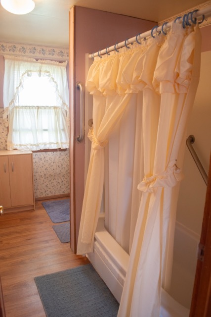 421 7th Avenue Erie, IL 61250 - Photo 16 of 27 a view of an empty room with wooden floor and a window