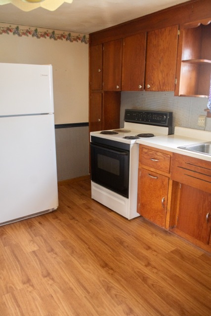 421 7th Avenue Erie, IL 61250 - Photo 8 of 27 a kitchen with a refrigerator stove and cabinets