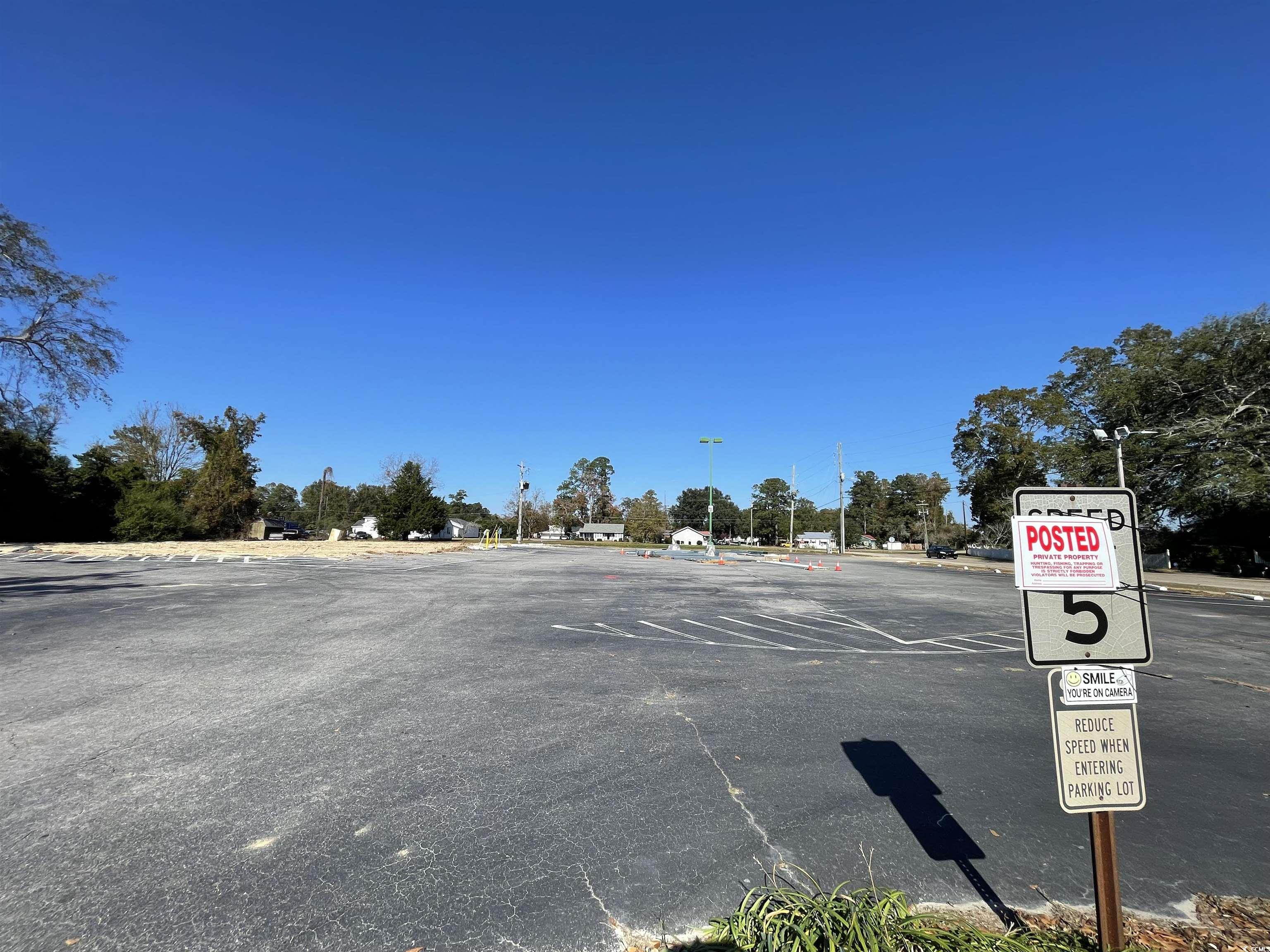 312 East Broad Street Hemingway, SC 29554 - Photo 20 of 25 View of asphalt street with traffic signs and street lights