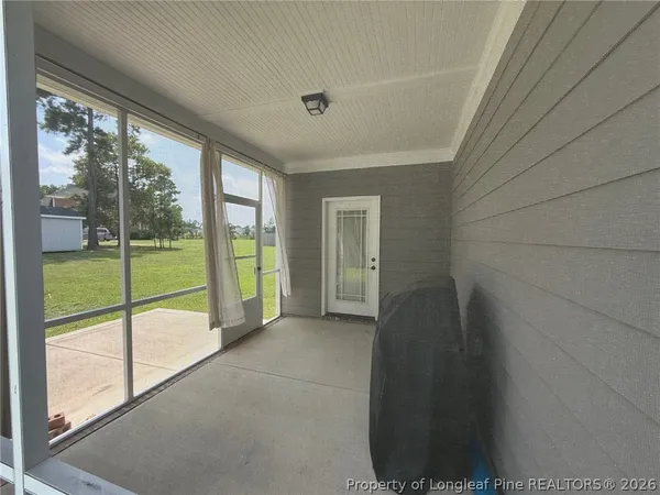 a view of an empty room and window