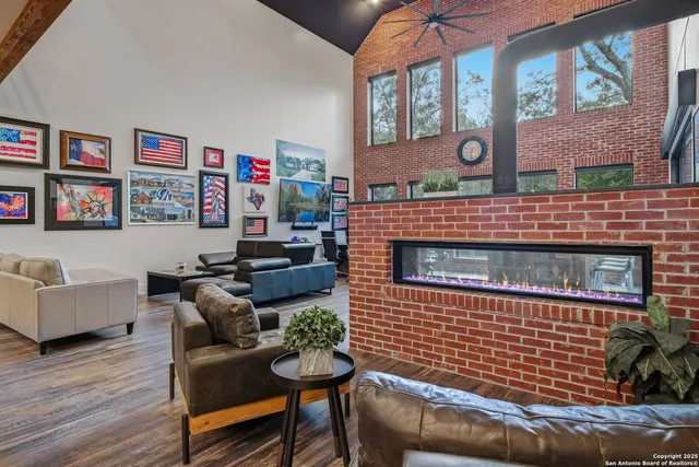 a living room with furniture a window and a table