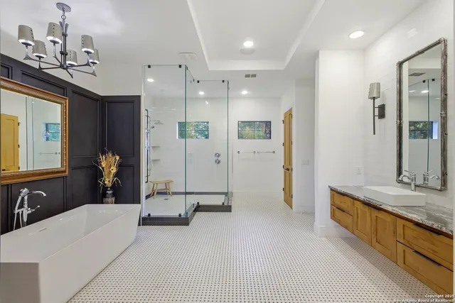 a bathroom with a bathtub and a window