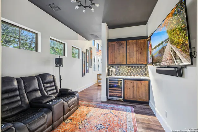 a bedroom with furniture and painting on the wall