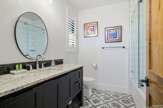 a utility room with sink dryer and washer